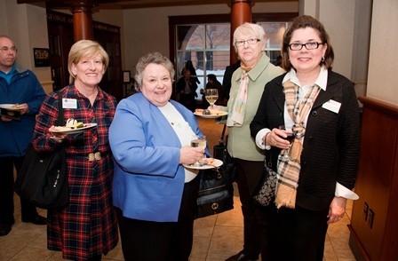 Faculty members enjoy post-convocation food and drinks together